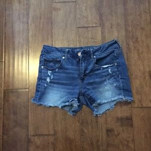 Medium wash shorts with frayed bottoms